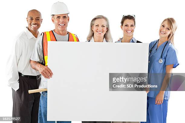 happy group of different professionals holding large blank sign - blank sign stock pictures, royalty-free photos & images