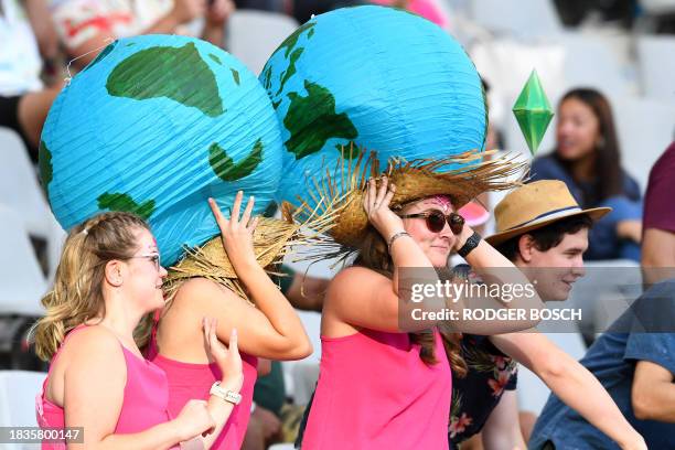 Supporters cheer from the stand during the HSBC World Rugby Sevens Series 2023 tournament at the Cape Town stadium in Cape Town on December 9, 2023.