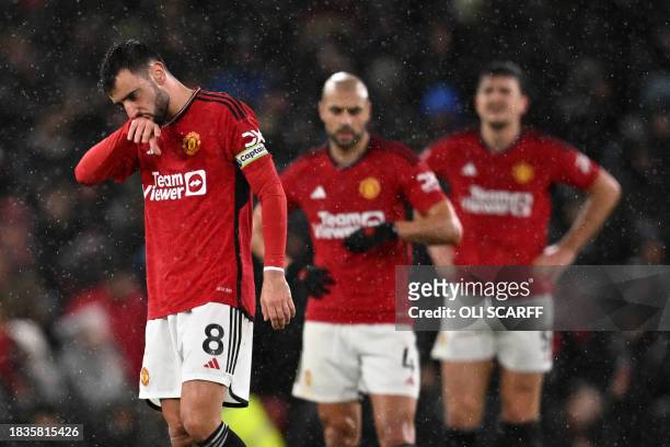 Manchester United's Portuguese midfielder Bruno Fernandes reacts after they concede their second goal during the English Premier League football...