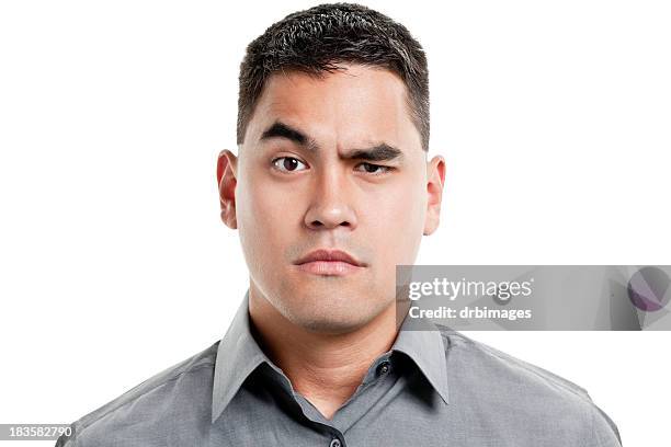 uncertain young man raises one eyebrow - no emotion stock pictures, royalty-free photos & images