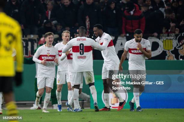 Serhou Guirassy celebrates after scoring his team's first goal with his teammates during the DFB cup round of 16 match between VfB Stuttgart and...