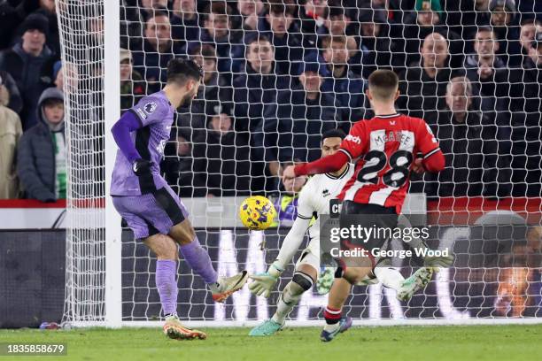 Dominik Szoboszlai of Liverpool scores his team's second goal past Wes Foderingham of Sheffield United during the Premier League match between...