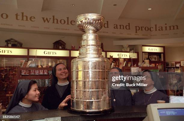 Portrait of Stanley Cup trophy surrounded by nuns while on tour thanks to Sports Illustrated via Getty Images senior writer Rick Reilly at Pauline...