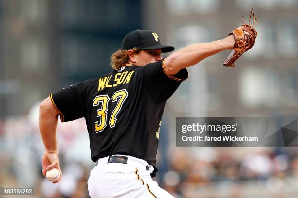 Justin Wilson of the Pittsburgh Pirates throws a pitch in the seventh inning against the St. Louis Cardinals during Game Four of the National League...