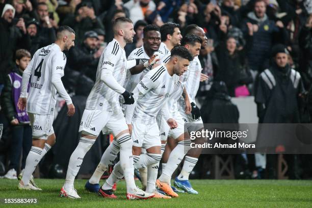 Alex Oxlade-Chamberlain of Besiktas celebrates with teammates after scoring his team's first goal during the Turkish Super League match between...