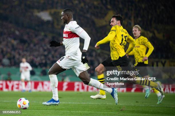 Serhou Guirassy of Stuttgarts misses a chance to score against Mats Hummels of Dortmund during the DFB cup round of 16 match between VfB Stuttgart...