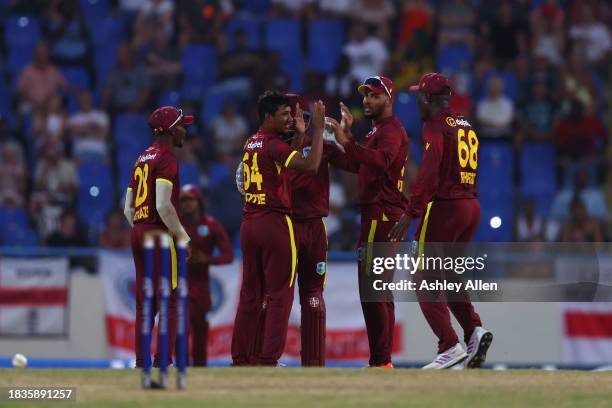 Gudakesh Motie of West Indies celebrates with teammates after getting the wicket of Ben Duckett of England during the 2nd CG United One Day...