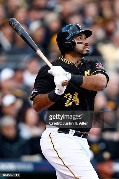 Pedro Alvarez of the Pittsburgh Pirates hits a solo home run in the eighth inning against Michael Wacha of the St. Louis Cardinals during Game Four...