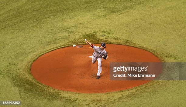 Clay Buchholz of the Boston Red Sox pitches in the first inning against the Tampa Bay Rays during Game Three of the American League Division Series...