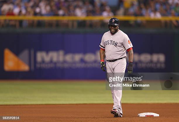David Ortiz of the Boston Red Sox smiles while leading off second base in the fourth inning against the Tampa Bay Rays during Game Three of the...