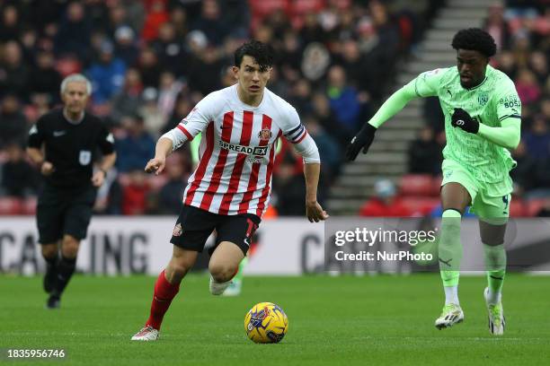 Luke O'Nien of Sunderland is being chased by Josh Maja of West Bromwich Albion during the Sky Bet Championship match between Sunderland and West...