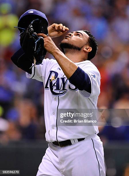 Alex Torres of the Tampa Bay Rays reacts after a strike out to end the sixth inning against the Boston Red Sox during Game Three of the American...