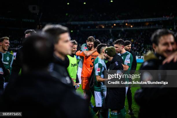 Niklas Stark of Bremen hugs Goalkeeper Michael Zetterer of Bremen after the Bundesliga match between SV Werder Bremen and FC Augsburg at Wohninvest...