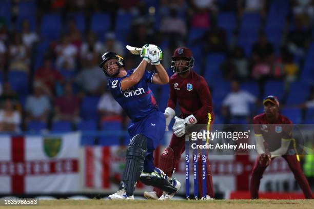 Jos Buttler of England hits a six during the 2nd CG United One Day International match between West Indies and England at Sir Vivian Richards Stadium...