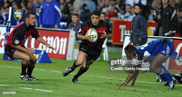 Left Caleb Ralph and Daniel Carter of the Crusaders and Joe Rokocoko in action during the Super 12 match between the Auckland Blues and the...