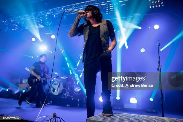 Kellin Quinn and Jesse Lawson of Sleeping With Sirens perform on stage at Manchester Academy on October 7, 2013 in Manchester, England.