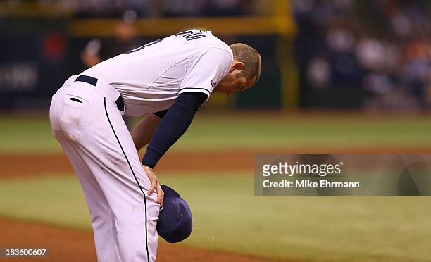 Evan Longoria of the Tampa Bay Rays looks on in the ninth inning against the Boston Red Sox during Game Three of the American League Division Series...
