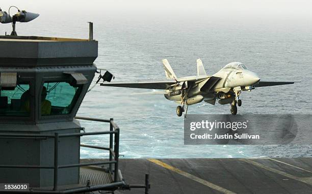 Navy F/A-18 Hornet comes in to land on the deck of the U.S.S. Constellation after completing a patrol mission over Iraq March 2003 in the Arabian...