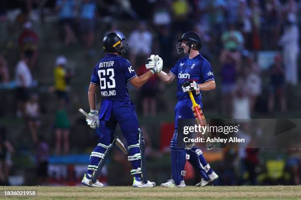 Jos Buttler and Harry Brook of England during the 2nd CG United One Day International match between West Indies and England at Sir Vivian Richards...