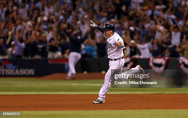 Jose Lobaton of the Tampa Bay Rays rounds the bases after hitting a walk off home run in the bottom of the ninth to defeat the Boston Red Sox during...