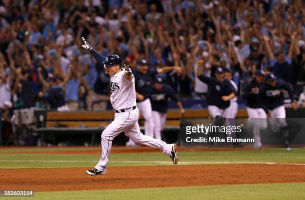 Jose Lobaton of the Tampa Bay Rays rounds the bases after hitting a walk off home run in the bottom of the ninth to defeat the Boston Red Sox during...