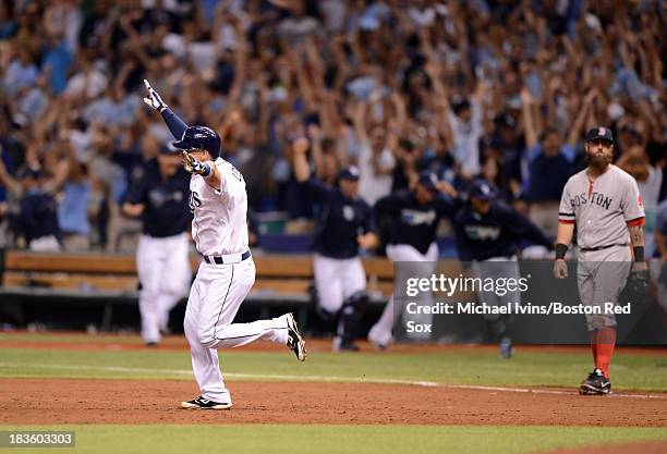 Jose Lobaton of theTampa Bay Rays reacts after hitting a game-winning home run against Koji Uehara of the Boston Red Sox in the ninth inning of Game...