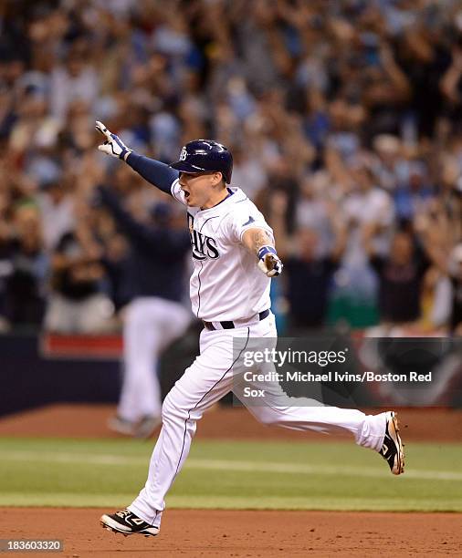 Jose Lobaton of theTampa Bay Rays reacts after hitting a game-winning home run against Koji Uehara of the Boston Red Sox in the ninth inning of Game...