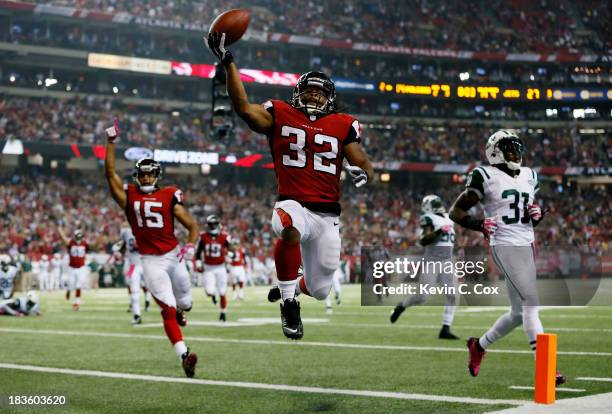 Running back Jacquizz Rodgers of the Atlanta Falcons scores his second touchdown of the game against the New York Jets during their game at the...