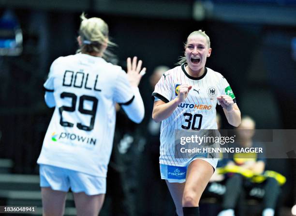 Germany's right winger Jenny Behrend celebrates a goal during the main round match between Serbia and Germany of the IHF Women's World Handball...