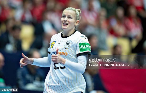 Germany's centre back Annika Lott celebrates a goal during the main round match between Serbia and Germany of the IHF Women's World Handball...