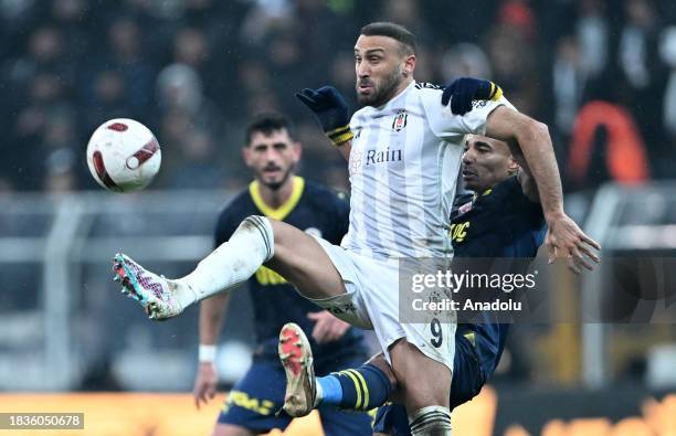Cenk Tosun of Besiktas in action against Alexander Djiku of Fenerbahce during the Turkish Super Lig week 15 match between Besiktas and Fenerbahce at...