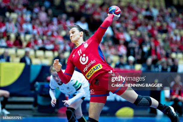 Serbia's right back Marija Lanistanin plays the ball during the main round match between Serbia and Germany of the IHF Women's World Handball...