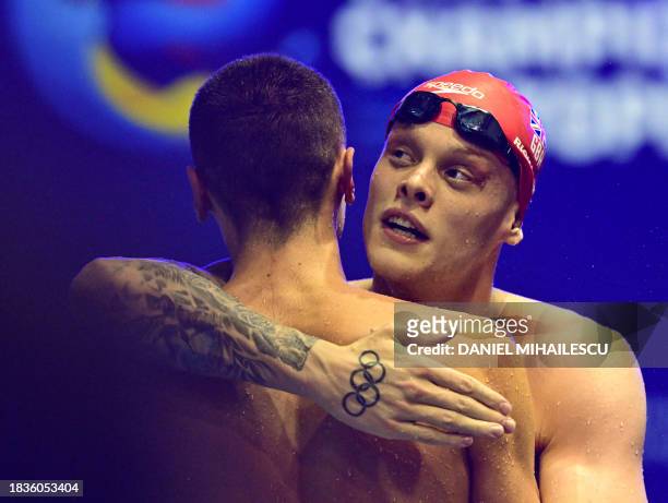 David Popovici of Romania and gold medalist Matthew Richards of Great Britain react after the men's 200m Freestyle final of the European Short Course...