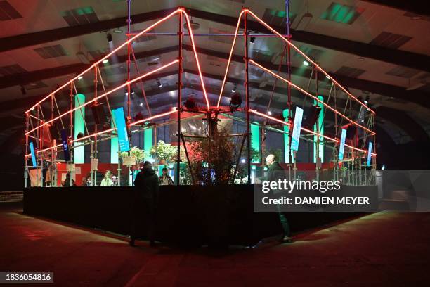 Goers take a drink in a bar during the "Les Trans Musicales" music festival in Rennes, western France on December 9, 2023.