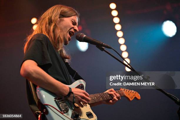 Post Nebbia band Italian singer Carlo Corbellini performs on stage during the "Les Trans Musicales" music festival in Rennes, western France on...