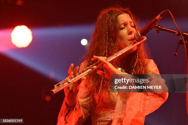 Heavenphetamine japanese band's ukrainian flutist Kira Krempova performs on stage during the "Les Trans Musicales" music festival in Rennes, western...