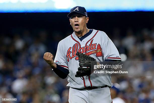 Starting pitcher Freddy Garcia of the Atlanta Braves celebrates after the third out in the fifth inning against the Los Angeles Dodgers in Game Four...