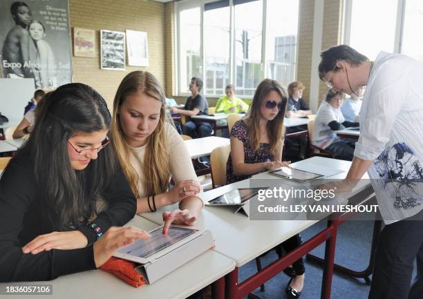 Students of the Hondsrug college use iPads during an English class in Emmen on April 18, 2011. After summer holidays, every class of Hondsrug college...