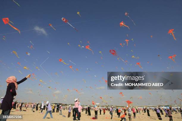Palestinian children in Gaza attending UNRWA's Summer Games attempt to smash their own world record for the number of kites flown simultaneously on...