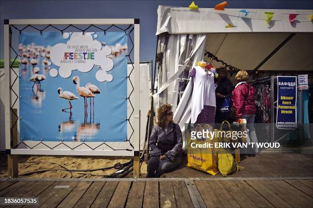 Woman takes a break at the Almeerder beach in Almere, during her visit at the Libelle Summer Week , on May 11, 2009. Visitors of this annual fair,...