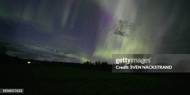 Display of Aurora Borealis, northern lights, in Ostby, 19 August 2006. The northern lights occur in a circular band around the geomagnetic north...