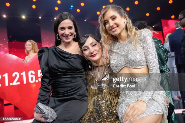 Saliha Oezcan, Kristina Vogel and Cathy Hummels during the Ein Herz fuer Kinder charity gala at Studio Berlin Adlershof on December 09, 2023 in...