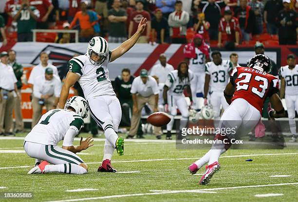 Nick Folk of the New York Jets kicks the game-winning field goal as time expired against the Atlanta Falcons at Georgia Dome on October 7, 2013 in...