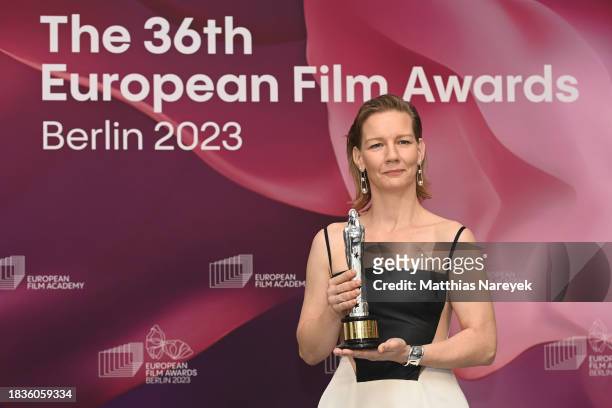 Actress Sandra Hüller poses with her award for Best Actress for "Anatomy of A Fall" during the 36th European Film Awards at arena Berlin on December...
