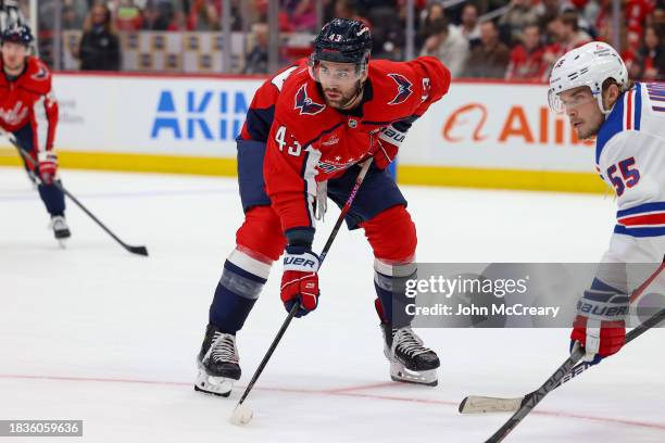 Tom Wilson of the Washington Capitals gets set for a face-off during a game against the New York Rangers at Capital One Arena on December 9, 2023 in...