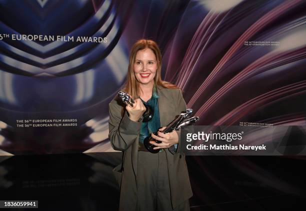 Director Justine Triet holds her awards for Best Film, Best Director and Best Screenwriter, all for "Anatomy of A Fall", at the 36th European Film...