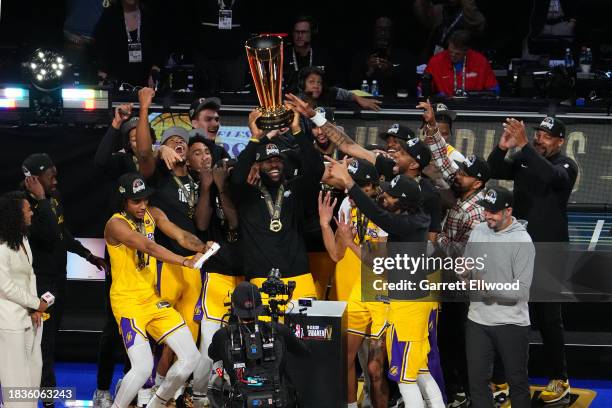 The Los Angeles Lakers celebrate with the NBA Cup after winning the In-Season Tournament Championship game against the Indiana Pacers on December 9,...