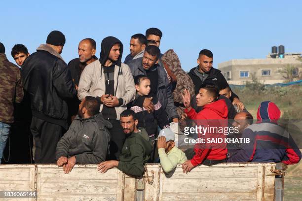 Palestinians flee Khan Yunis in southern Gaza Strip further south toward Rafah, along the Salah Al-Din road, on December 10, 2023. Israeli forces...