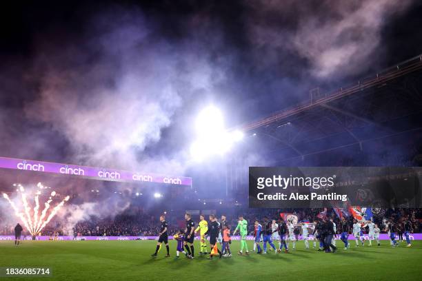 The two sides make their way out to fireworks during the Premier League match between Crystal Palace and AFC Bournemouth at Selhurst Park on December...