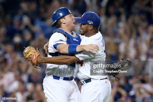 Ellis and Kenley Jansen of the Los Angeles Dodgers celebrate after the Dodgers defeat the Atlanta Braves 4-3 in Game Four of the National League...